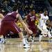 Michigan senior Eso Akunnedribbles around an IUPUI defender on Monday. He had three points. Daniel Brenner I AnnArbor.com